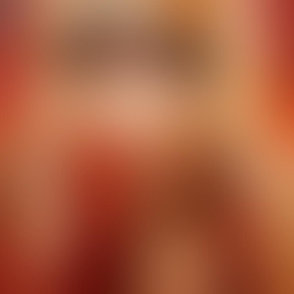 A vivid scene capturing an intimate moment between two figures, enveloped in soft, ambient light that enhances their allure. The background features abstract shapes and flowing silhouettes that symbolize desire and sensuality, with warm tones of red and gold highlighting their connection. Incorporate subtle hints of glamour, like sparkling elements, to elevate the mood. artistic expression, modern art style, warm colors.